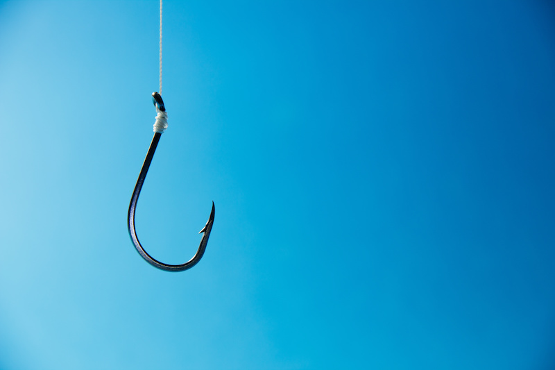 hook suspended with blue background
