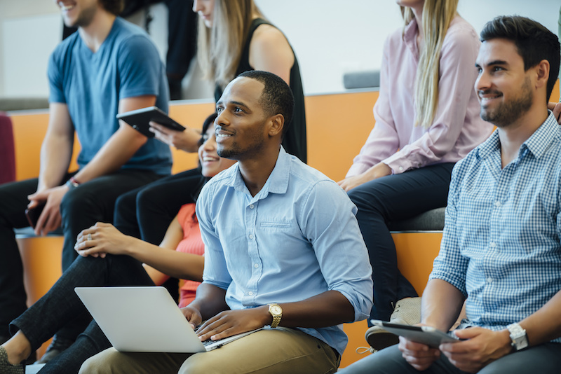 Group of people enjoying a lecture in a modern auditorium