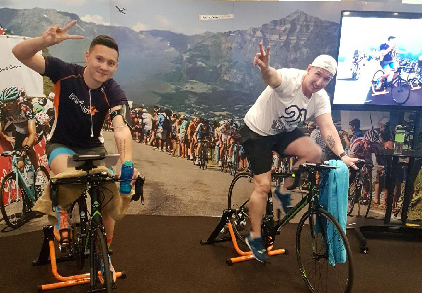NewsCorp employees riding Tour de Office bikes in office