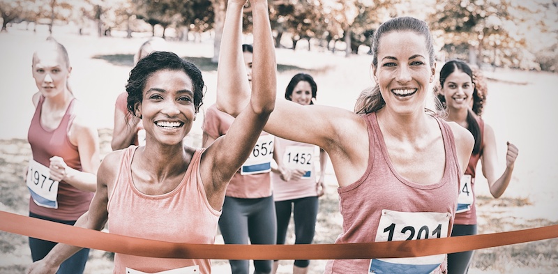 Participants crossing finish line at race