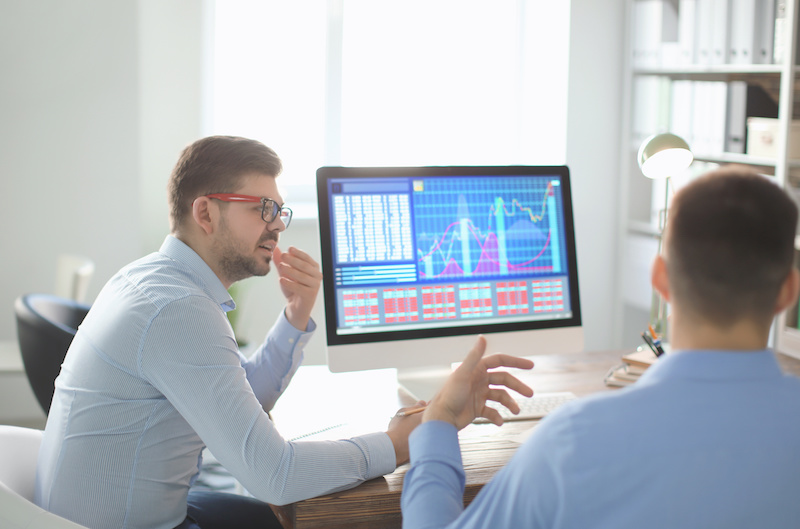 Young men working in office