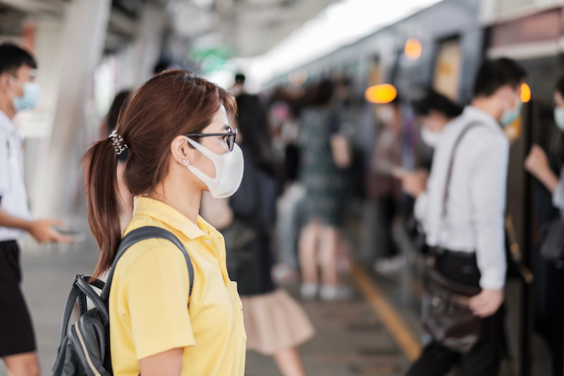 Wwoman wearing protection mask against coronavirus (2019-nCoV) or Wuhan coronavirus at public train station,is a contagious virus that causes respiratory infection.Healthcare concept