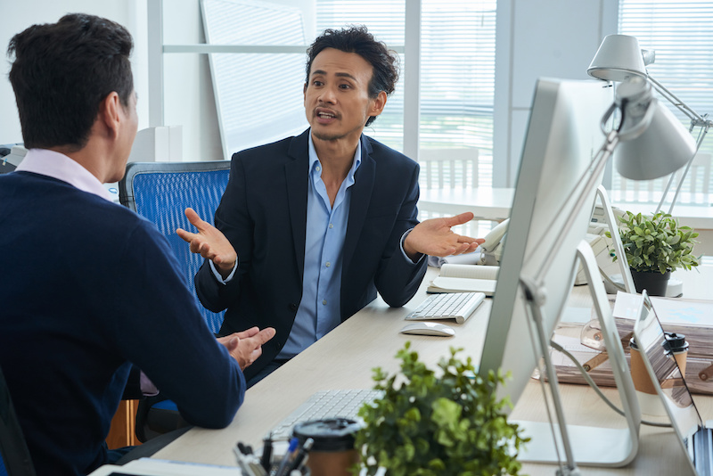 Business people having tough conversatinon about strategy of development