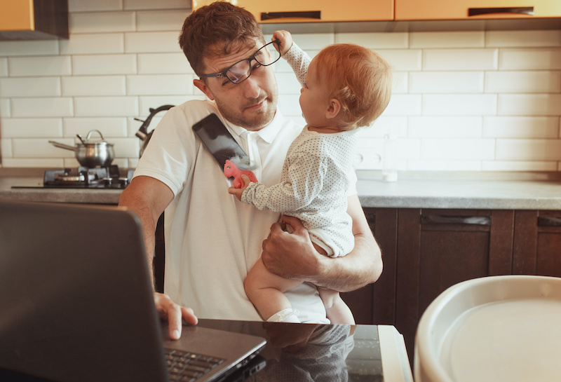 Work from home - working dad on laptop with daughter - new employer branding
