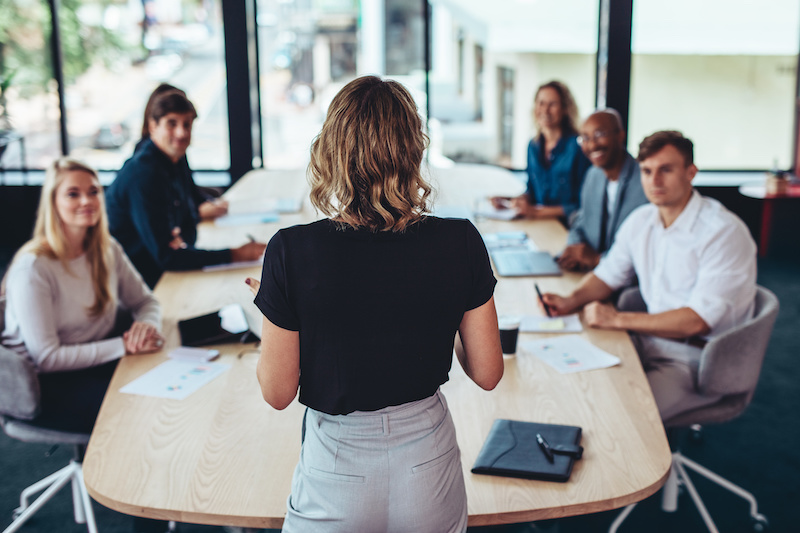 Businesswoman addressing a meeting in office. Female manager having a meeting with her team in office boardroom.